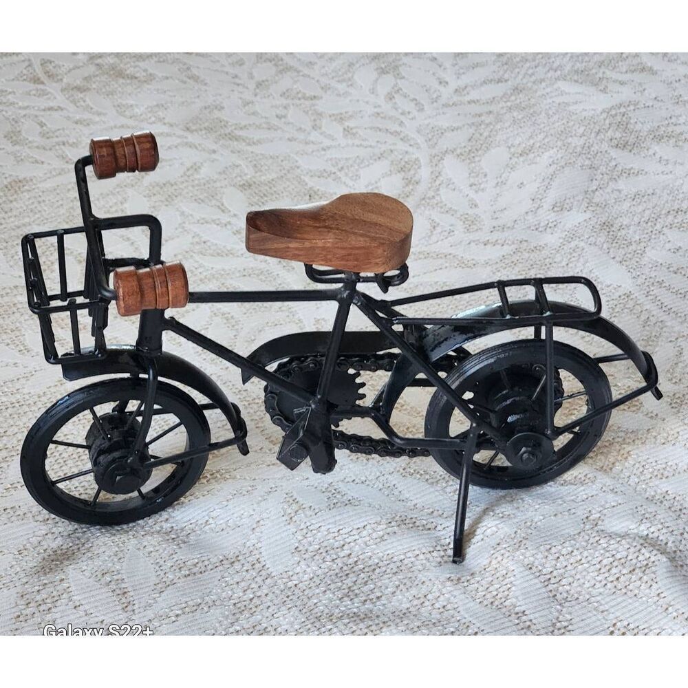 Cute black metal and wood standing bicycle decor with movable pedals and chain